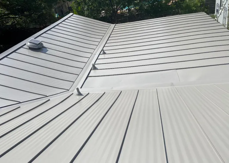 Solar attic fan installed on a metal roof for Roof Ventilation in Virginia Beach
